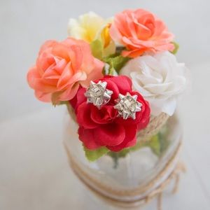 Big silver bow stud earrings